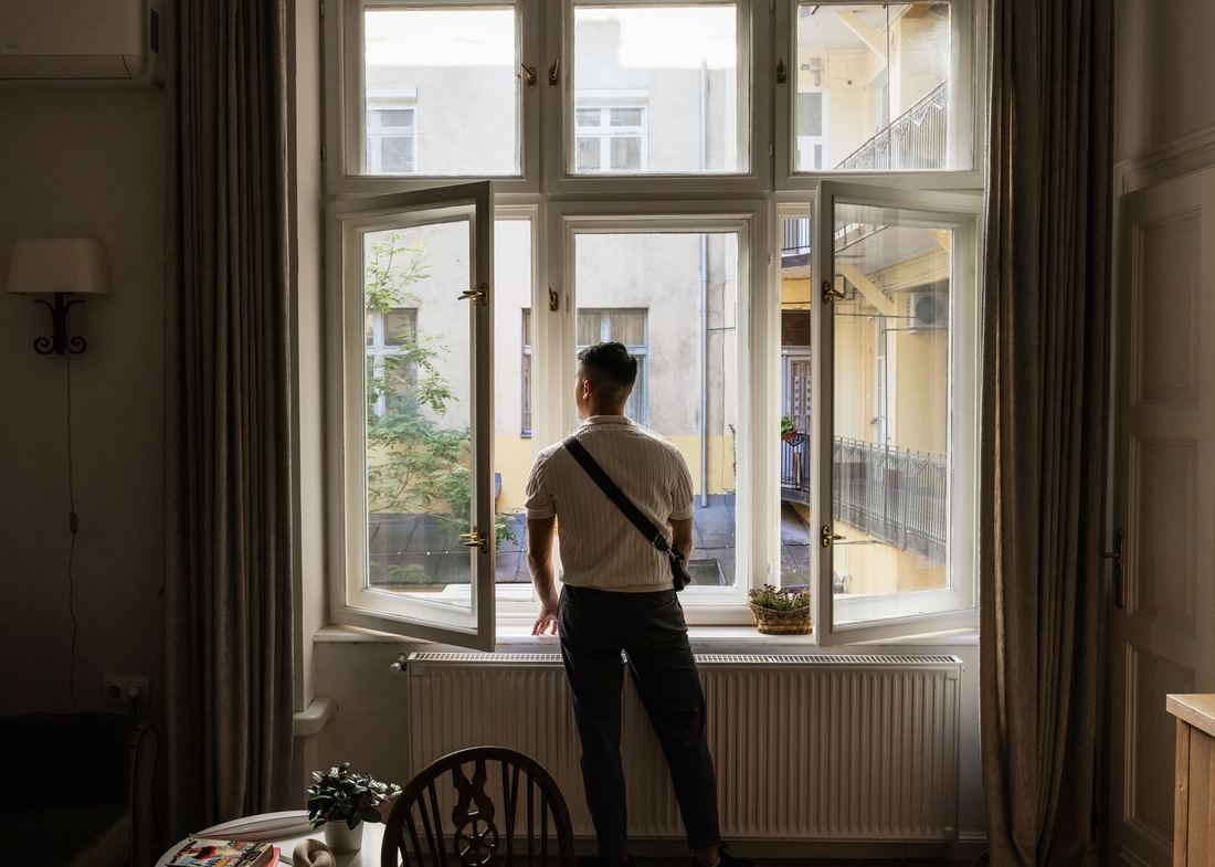 Guest looking out over the building's quiet inner courtyard